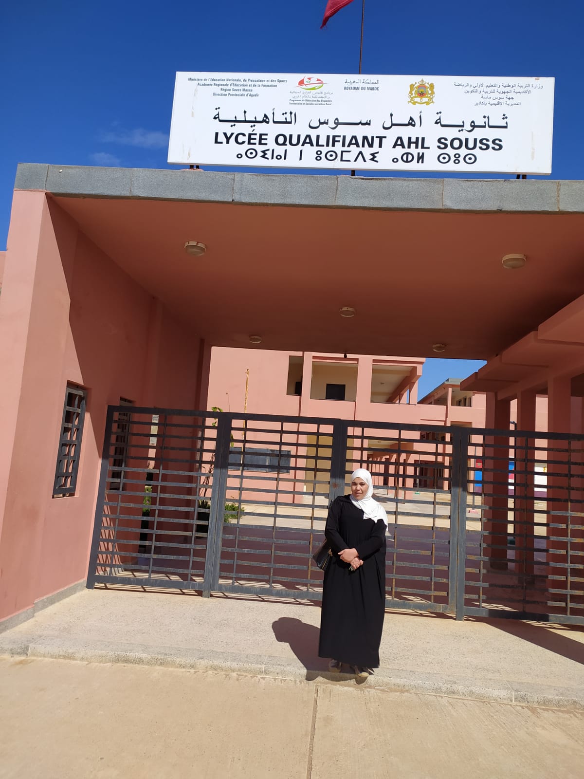 Miss Ahdarf stood in front of Ahel Souss High School in Morocco
